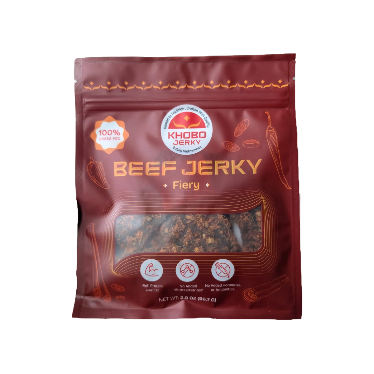 A 2 oz bag of KHOBO Jerky 'Fiery' grassfed tender Vietnamese beef jerky, featuring a dark red packaging design with lots of lemongrass and thai chili