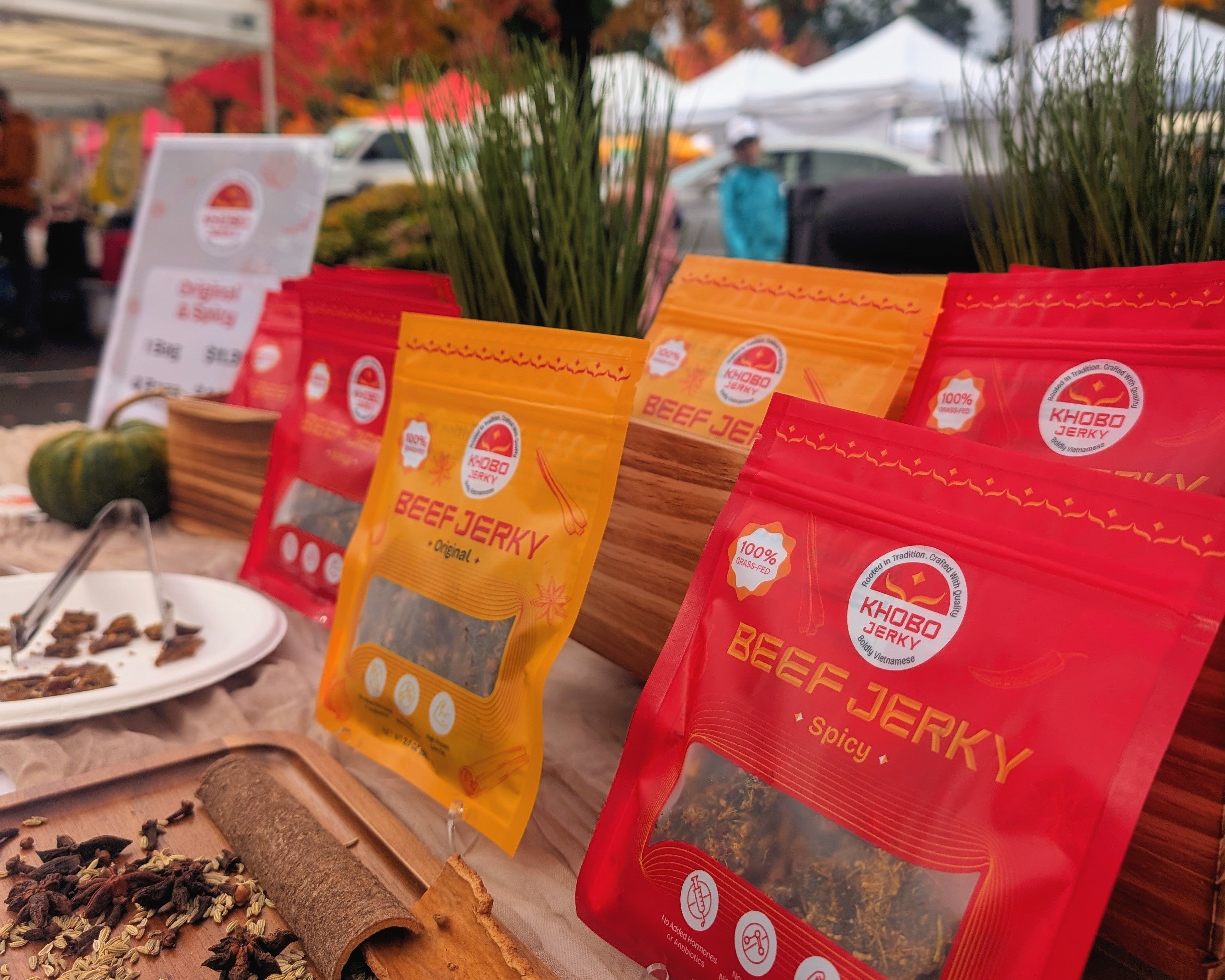 Handcrafted Vietnamese beef jerky packages on display at a farmers market in Washington