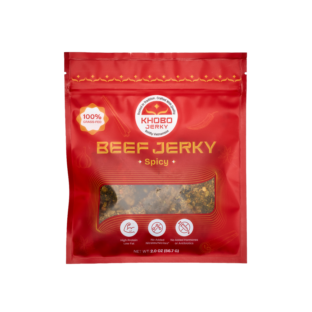 handcrafted grass fed tender Vietnamese beef jerky in a red packaging with lots of fresh aromatics, 
lemongrass and chili