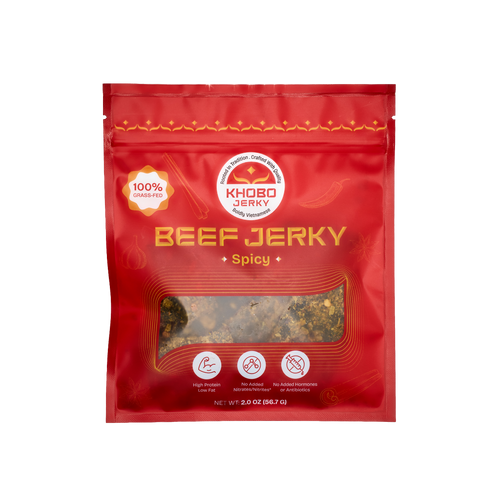 handcrafted grass fed tender Vietnamese beef jerky in a red packaging with lots of fresh aromatics, 
lemongrass and chili